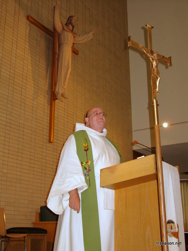 Fr. Tom preaching at the podium at the Espousal Center in Waltham, MA